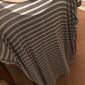 Light blue and white stripped tee shirt.